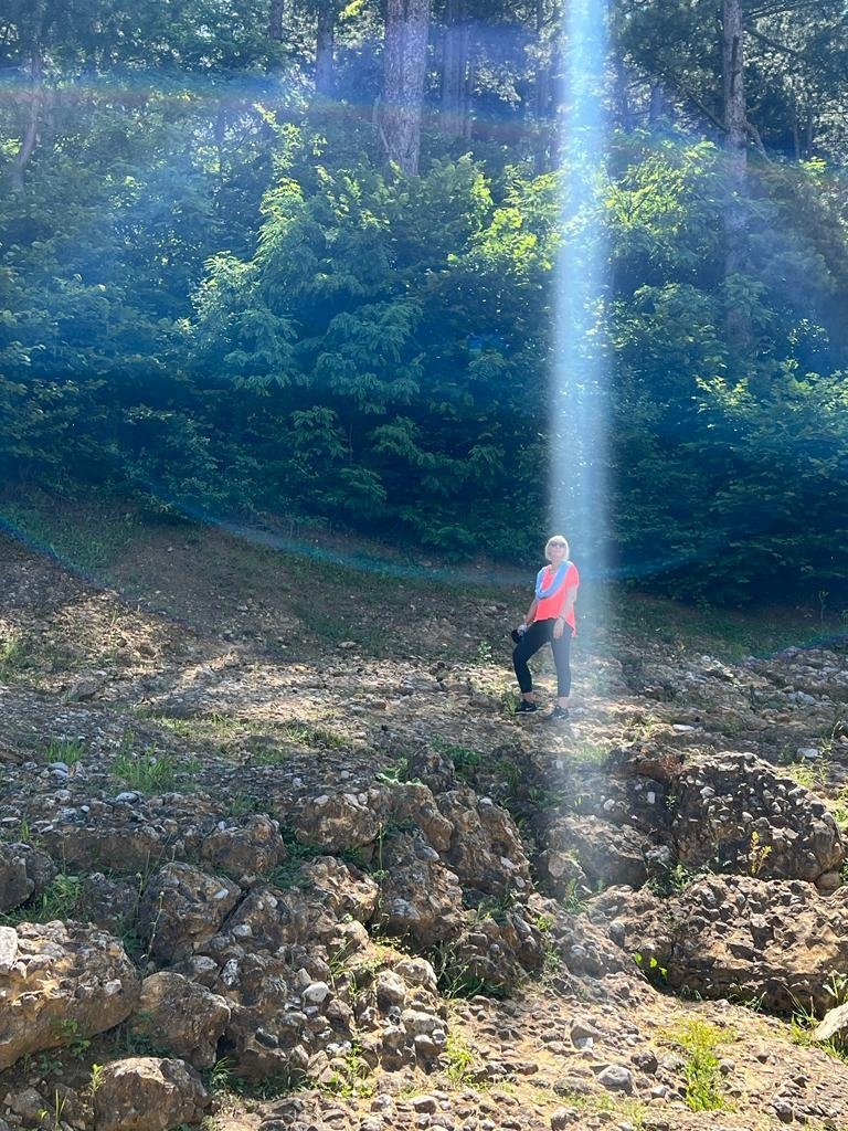 A beam of light surrounding Melissa